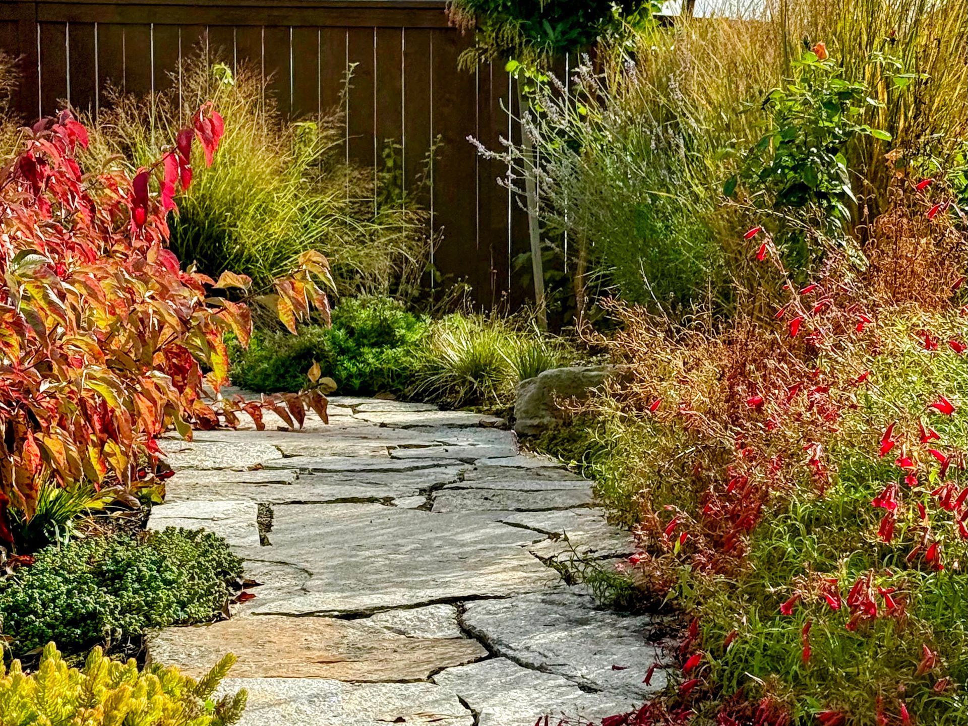 Adirondack seating with ferns and shade plants fiberglass planters