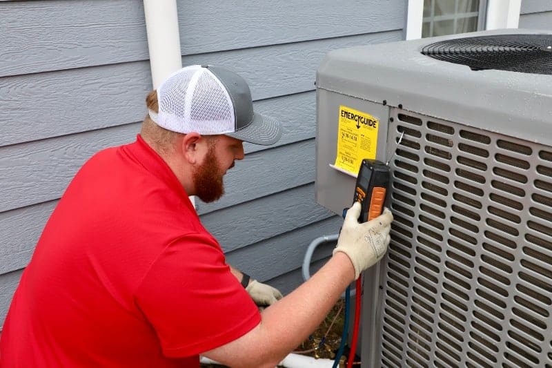 A man performing air conditioning repair in Wichita, KS
