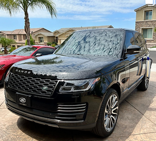 A Black Range Rover Is Parked Next To A Red Sports Car – Menifee, CA – Push N Pull Paintless