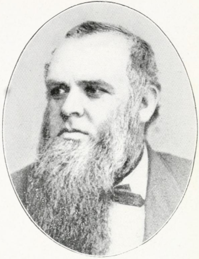 A black and white photo of a man with a beard