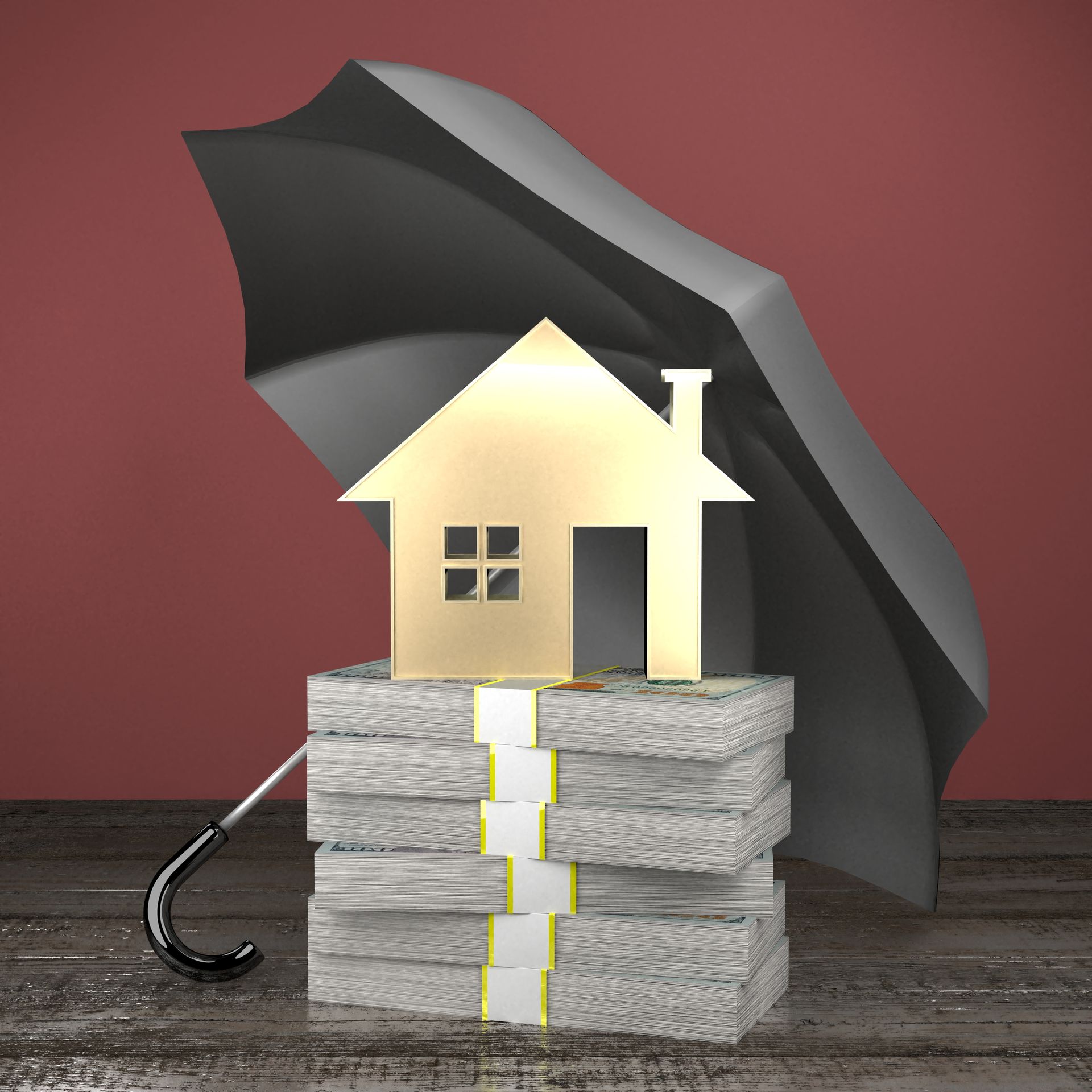 an umbrella covering a toy house on top of a stack of money