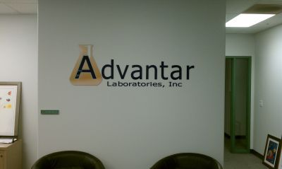 A sign on a wall that says advantar laboratories inc.