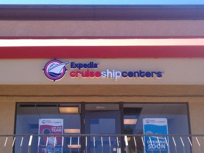 An expedia cruise ship centers store front with a balcony