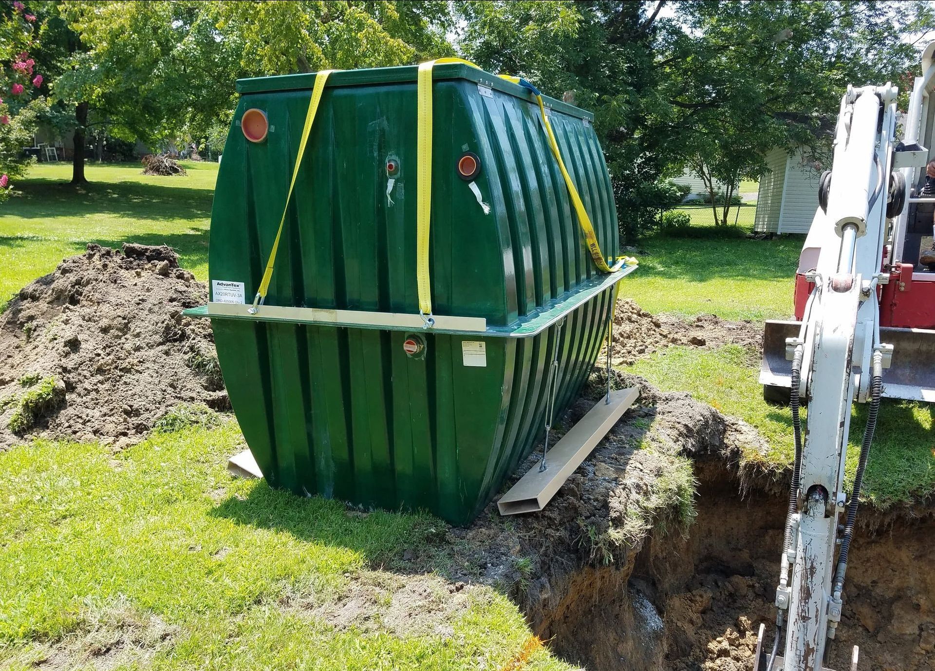 Septic tank about to be installed next to an excavator near Tuscaloosa, AL.