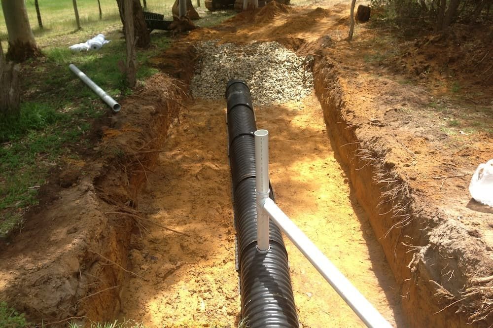 Repairing a septic system and buried drain lines in Tuscaloosa, AL.
