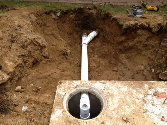 Digging up a distribution box for repair in Northport, AL.