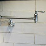 A Chrome Faucet Is Hanging On A White Tiled Wall | Wichita, KS | David Lies Plumbing