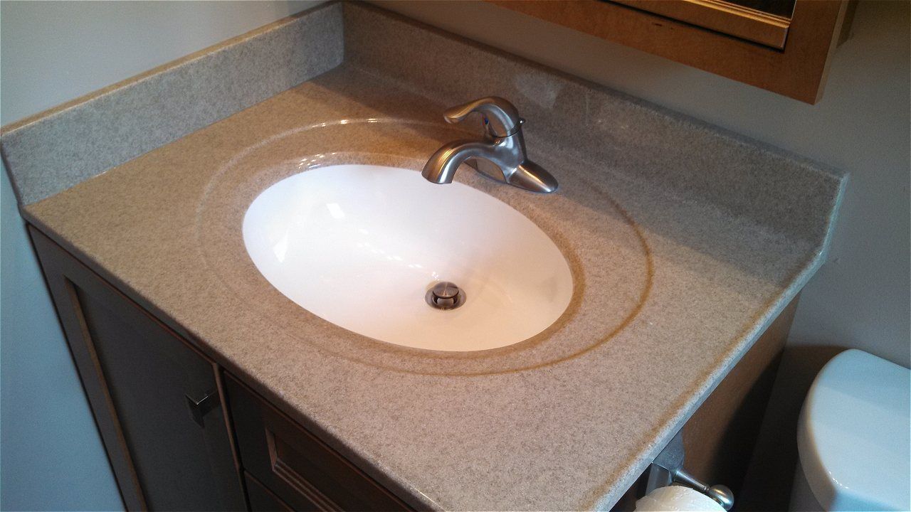 A Bathroom Sink With A Toilet In The Background | Wichita, KS | David Lies Plumbing