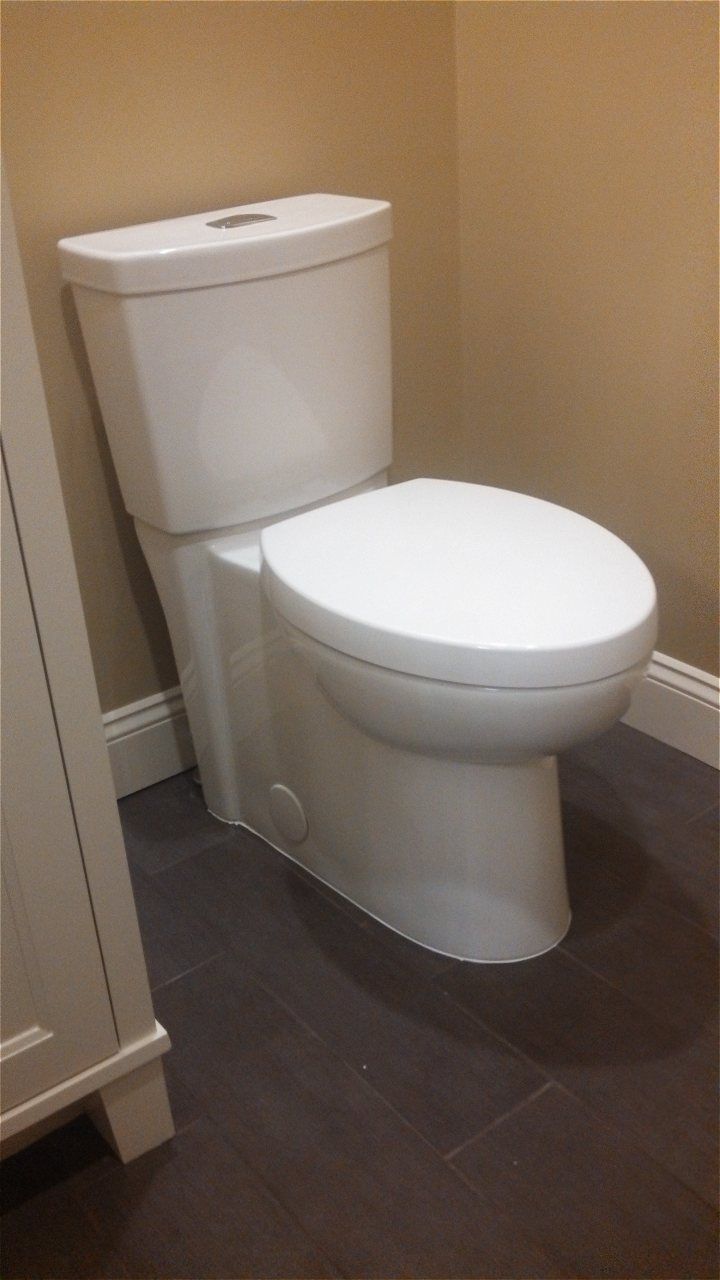 A White Toilet Is Sitting In A Corner Of A Bathroom | Wichita, KS | David Lies Plumbing