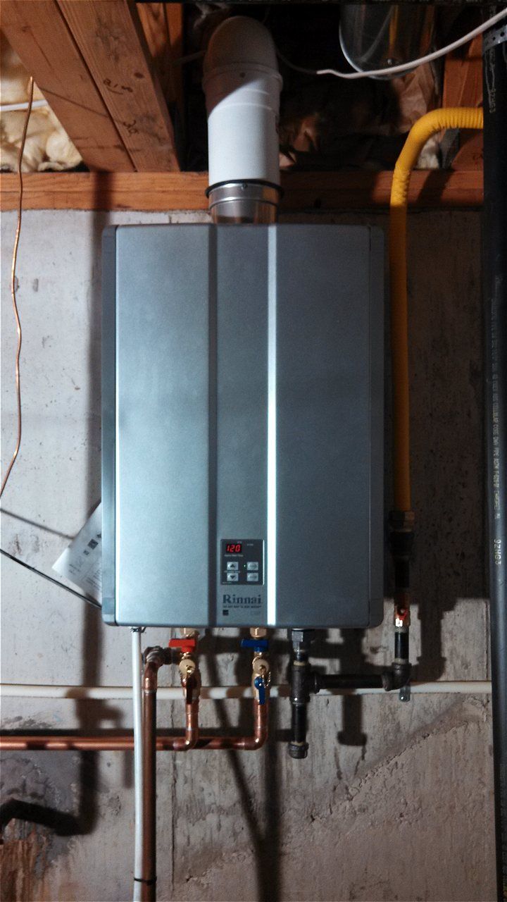 A Water Heater Is Mounted To The Wall In A Basement | Wichita, KS | David Lies Plumbing