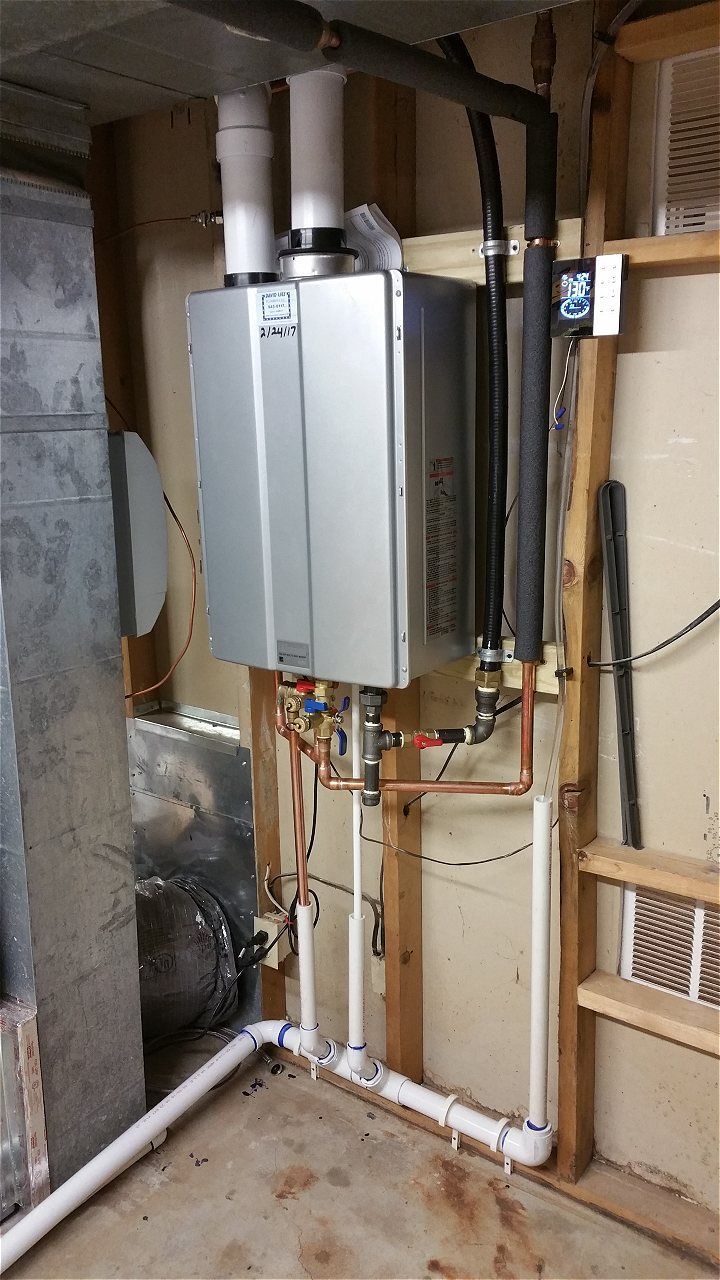 A Water Heater Is Installed In A Basement Next To A Ladder | Wichita, KS | David Lies Plumbing