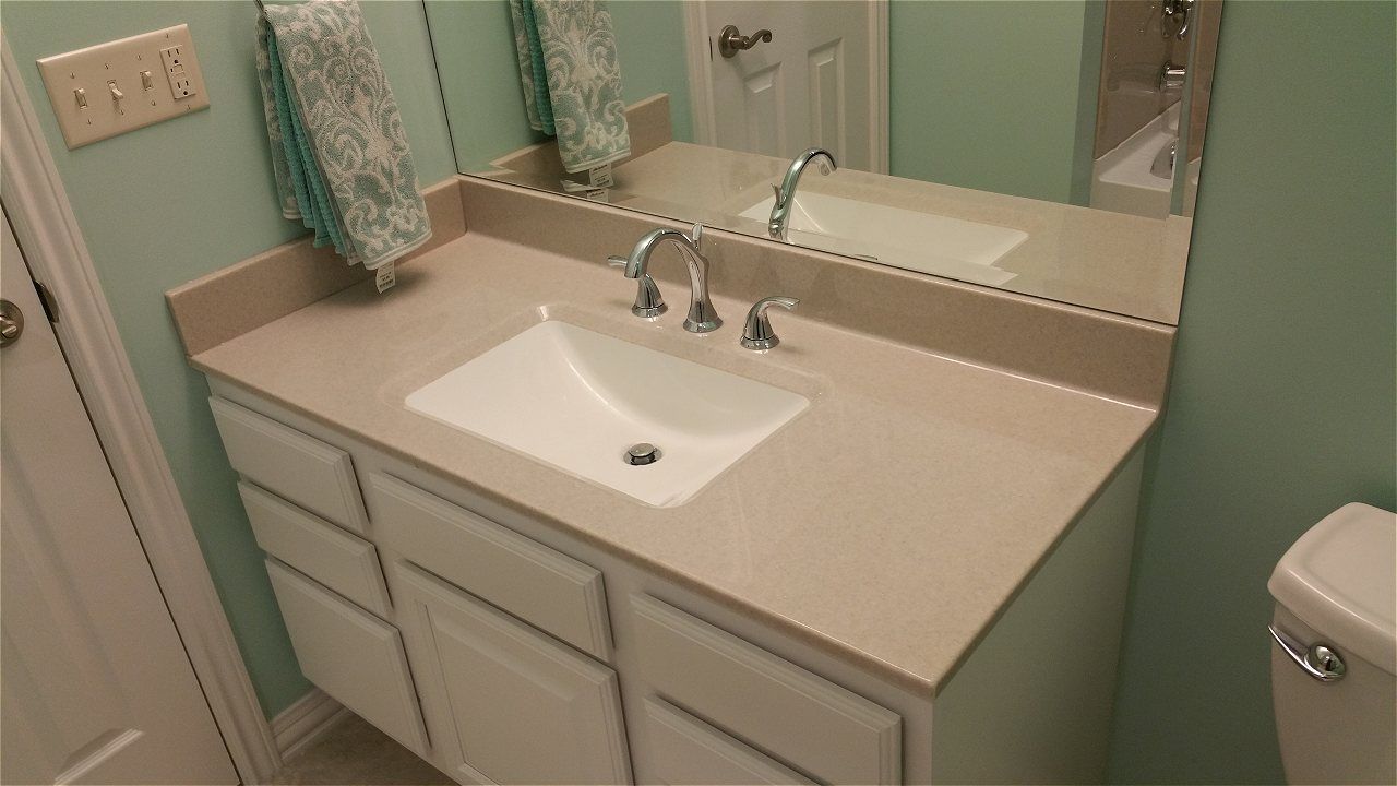 A Bathroom With A Sink, Mirror And Toilet | Wichita, KS | David Lies Plumbing