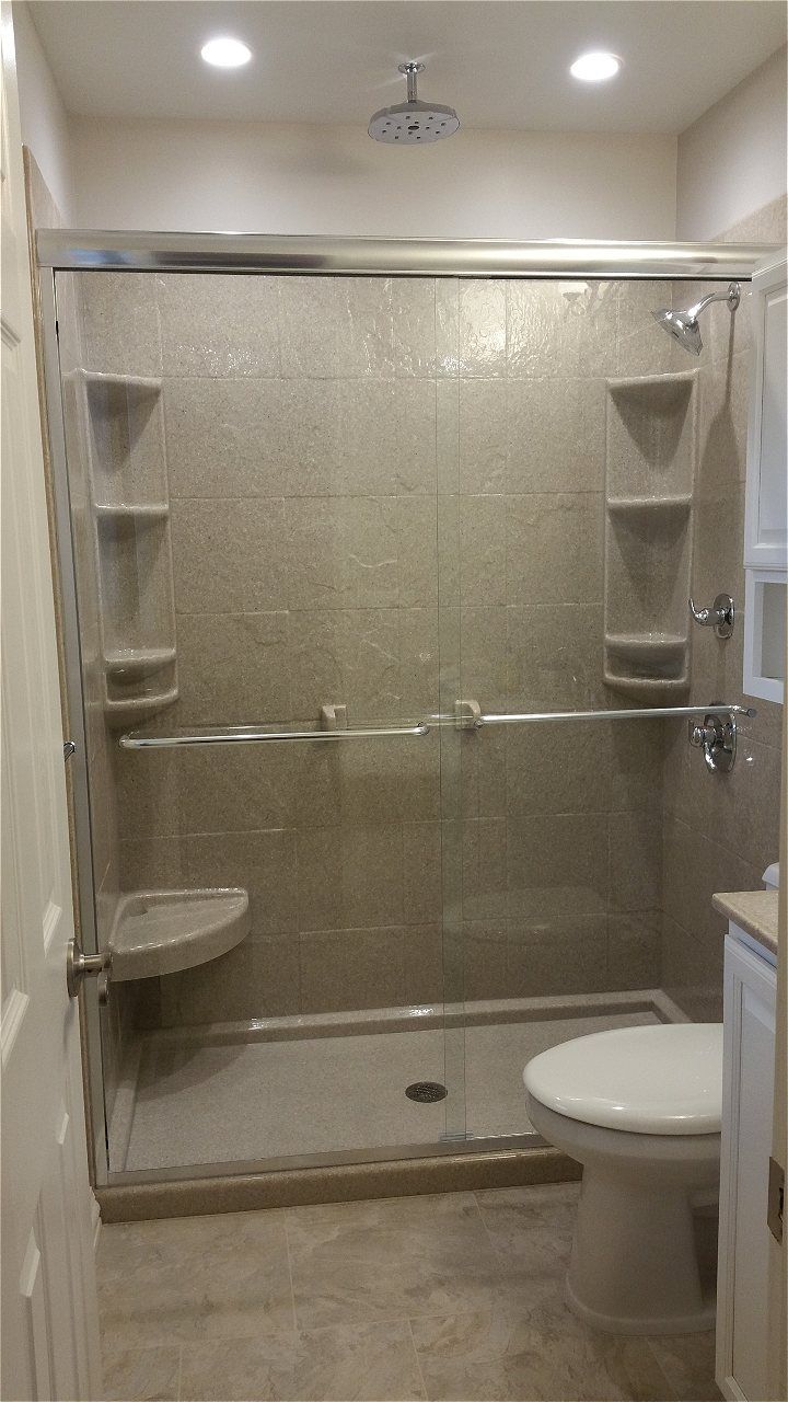 A Bathroom With A Walk In Shower And A Toilet | Wichita, KS | David Lies Plumbing