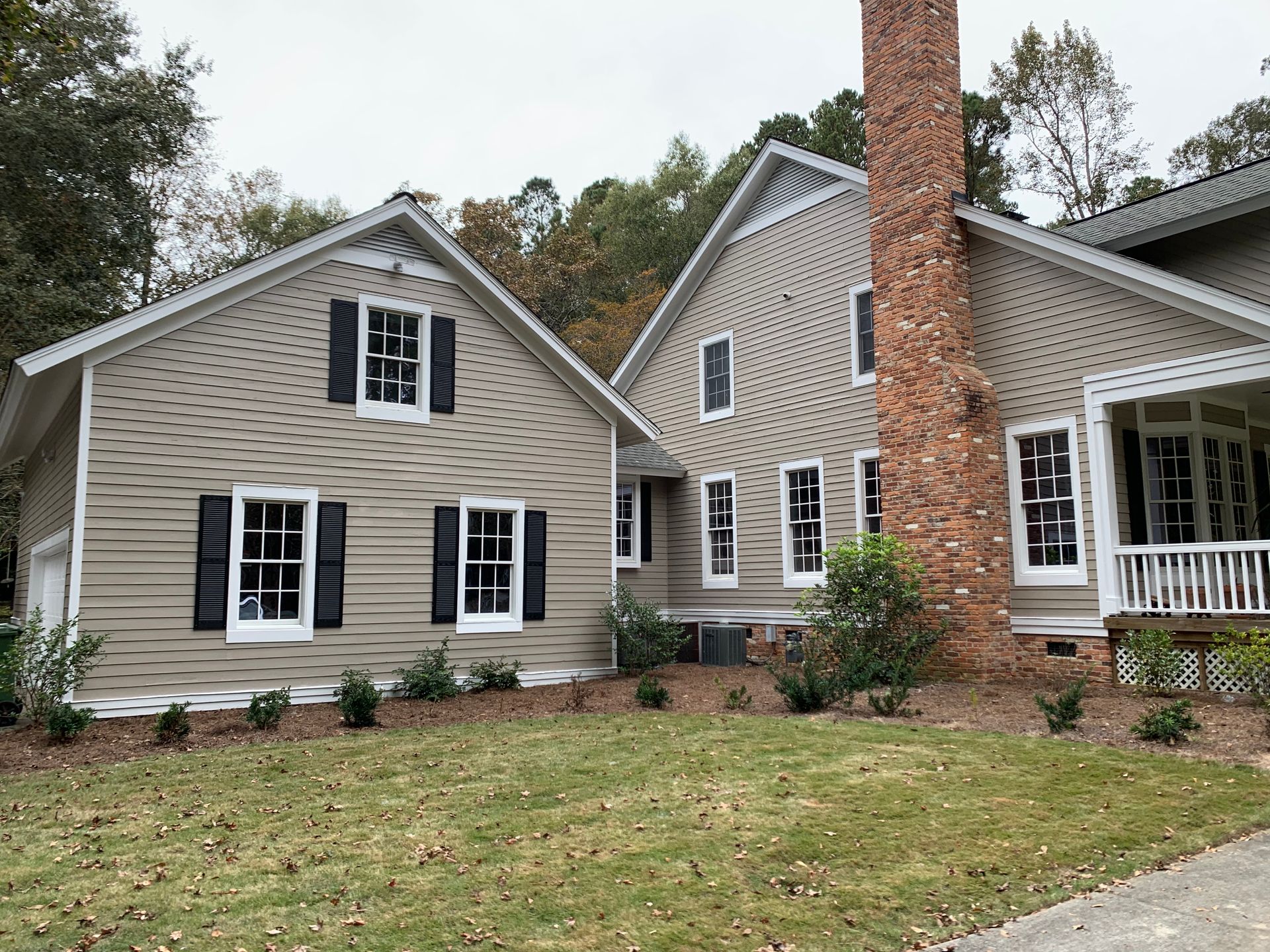 A man wearing a red hat with a slice of orange on it