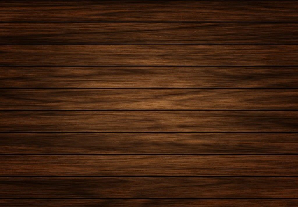 A close up of a wooden surface with a blurred background.