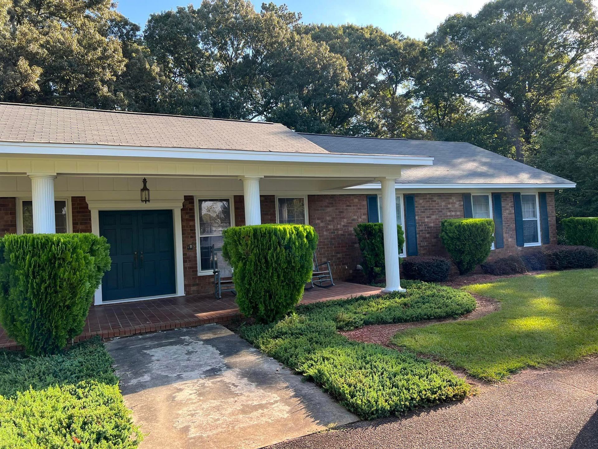 A brick house with a blue garage door
