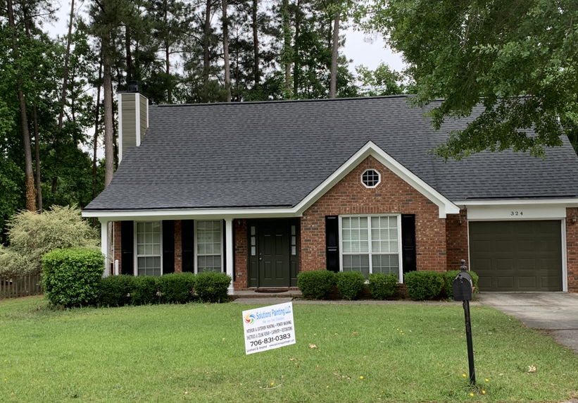 A tube of restorative hair mask next to a box