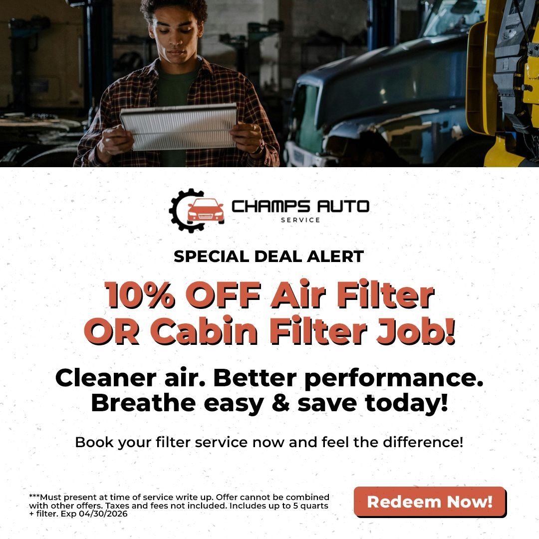 A mechanic in a workshop reads a document. Below is a Champs Auto Service ad for 10% off an air or cabin filter service.