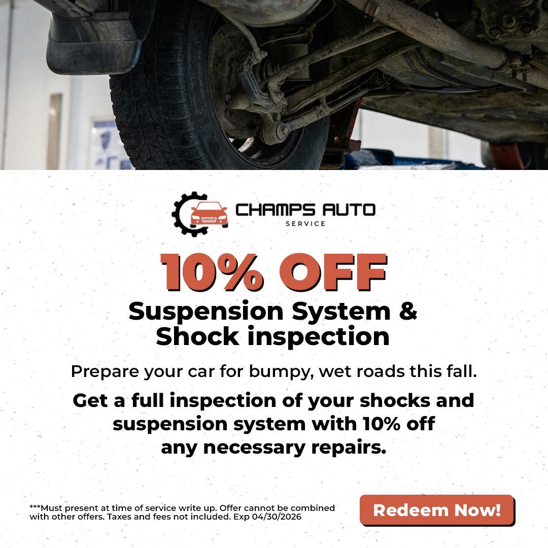 Ad for Champs Auto Service offering 10% off suspension system and shock inspection. Image of car's underside.