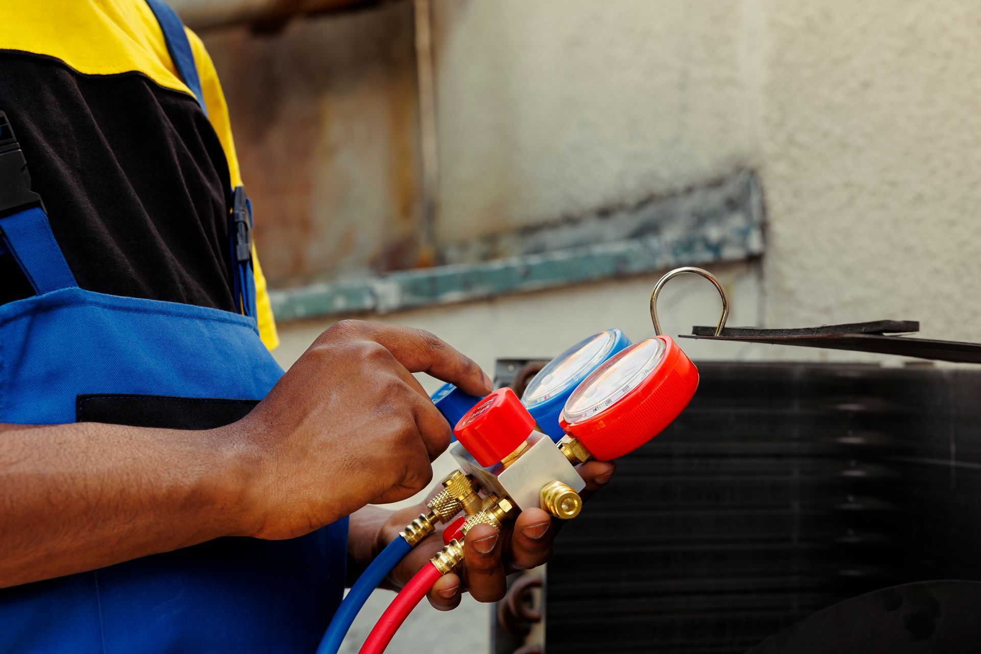 A man is holding a bunch of gauges in his hands.