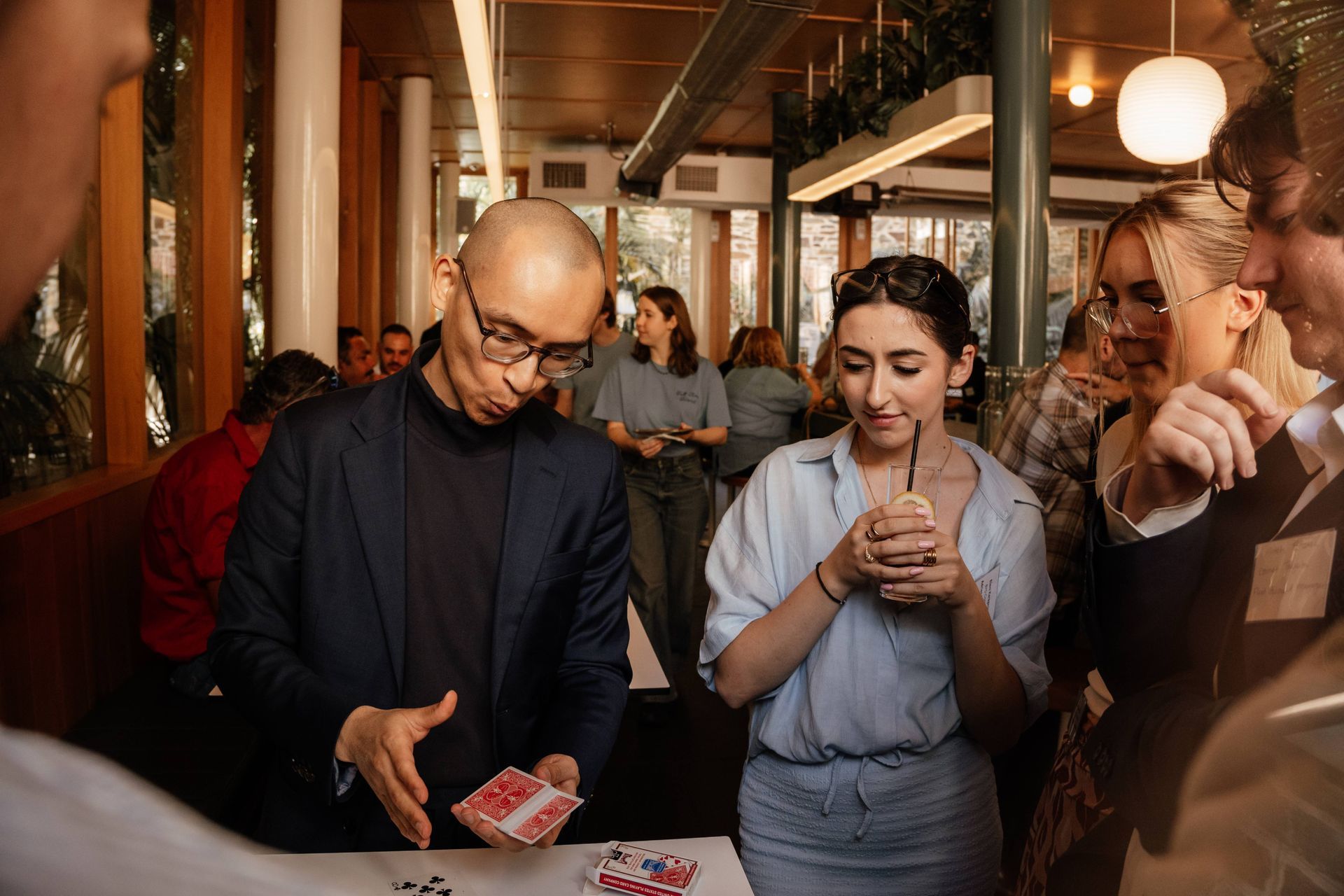 Party magician Adelaide performing magic at adult birthday celebration
