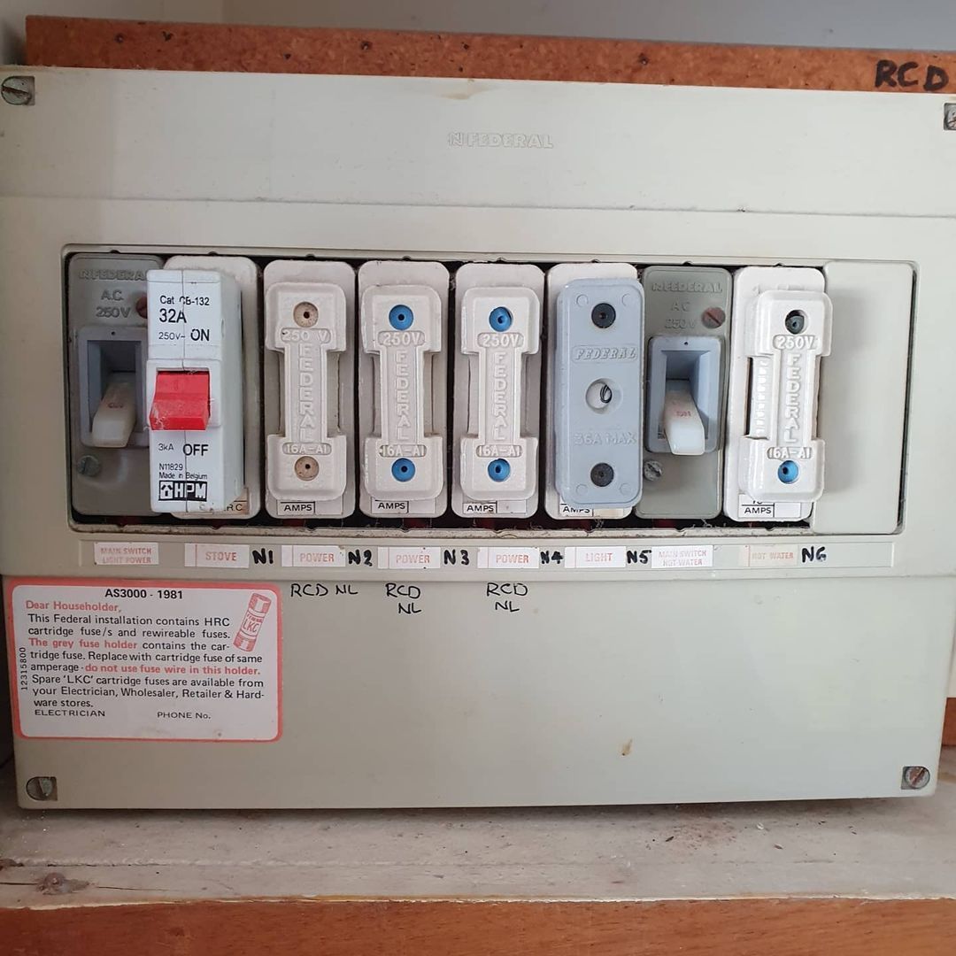 Electrician Installing Switches — Electrical Services in Southport, QLD