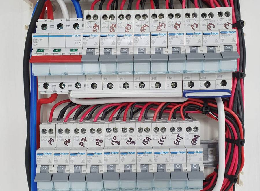Hand Switchboard Close Up — Electrical Services in Southport, QLD