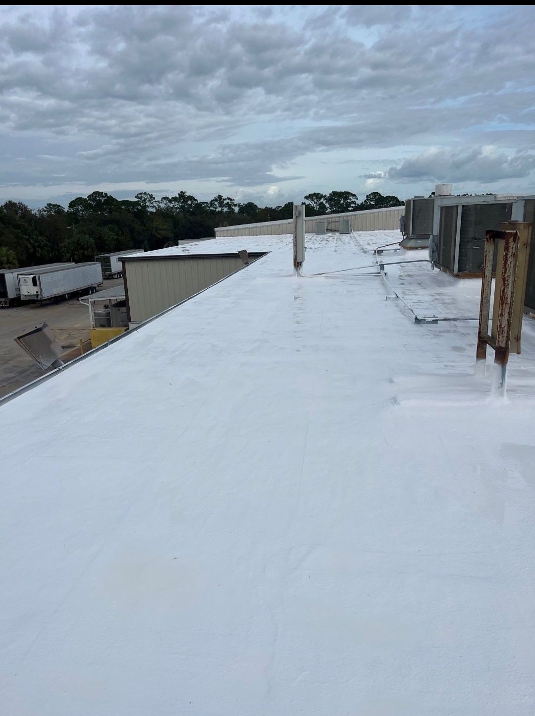 Kings commercial roofing LLC- roof restoration - spray coating