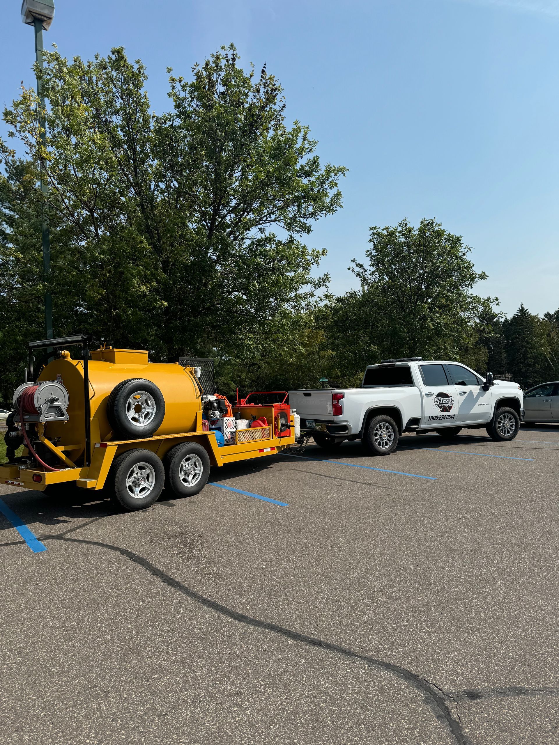 Two trucks are parked next to each other in a parking lot.