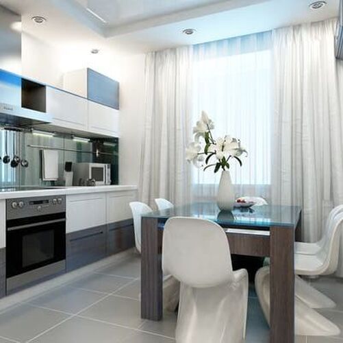 White kitchen with stainless appliances, dark timber table with white chairs, backed by sheet white curtains with sun shining through.