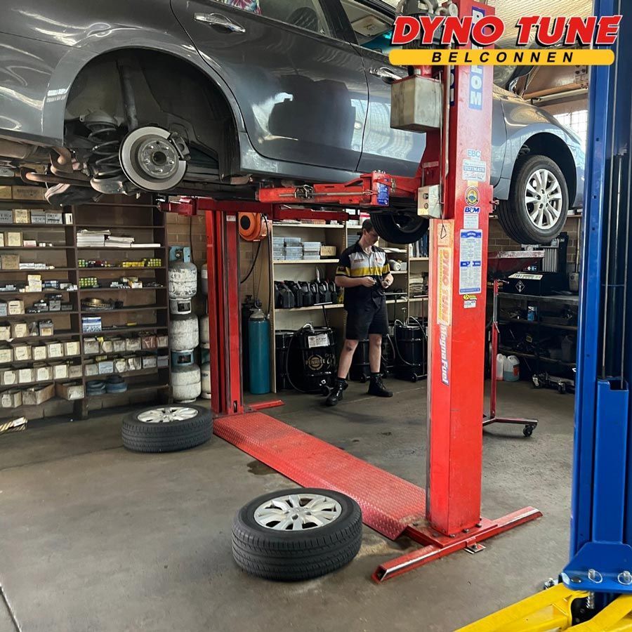Gray Car On Car Lift — Mechanic In Belconnen, ACT