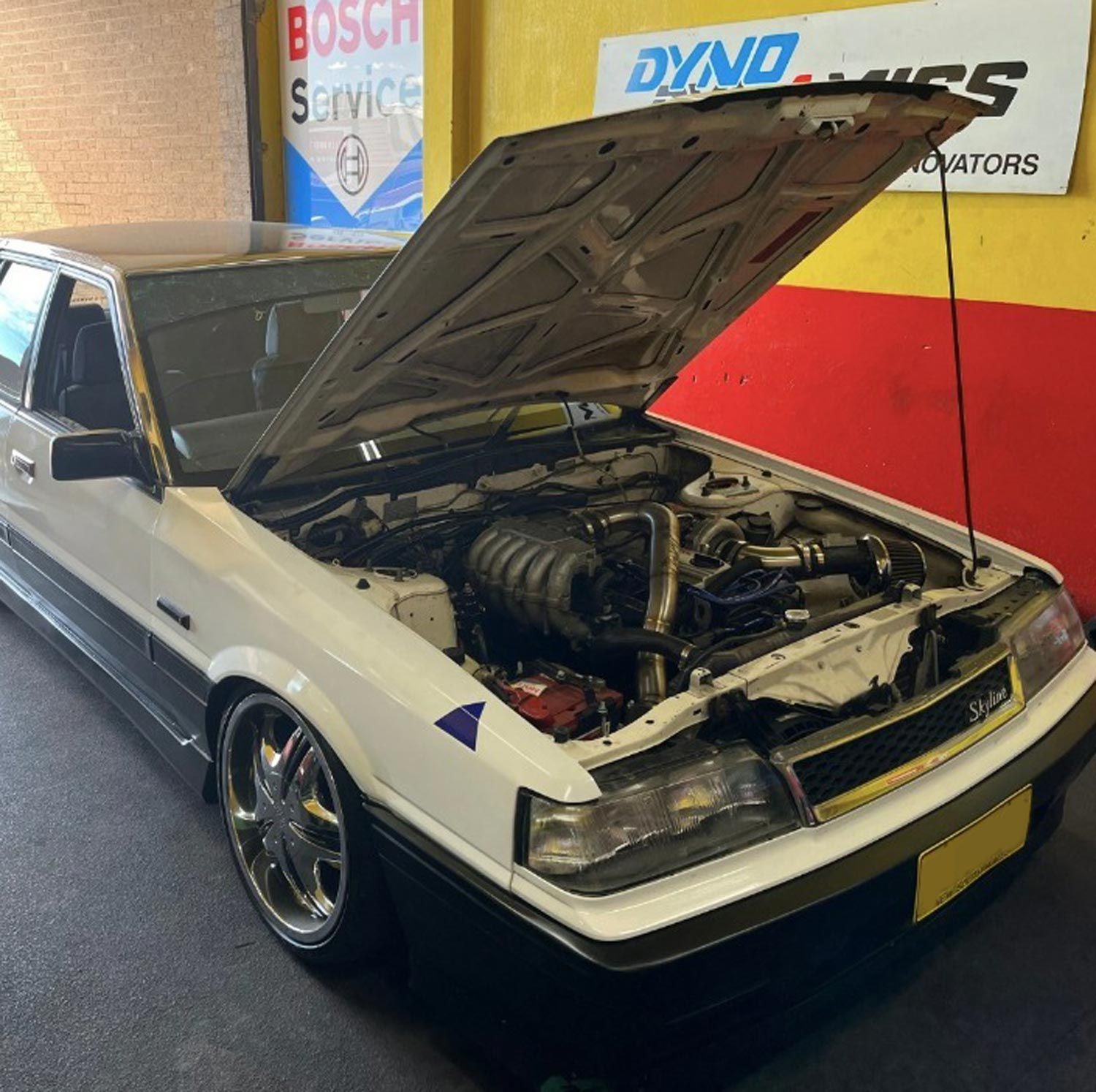 Car With Open Hood With Visible Engine