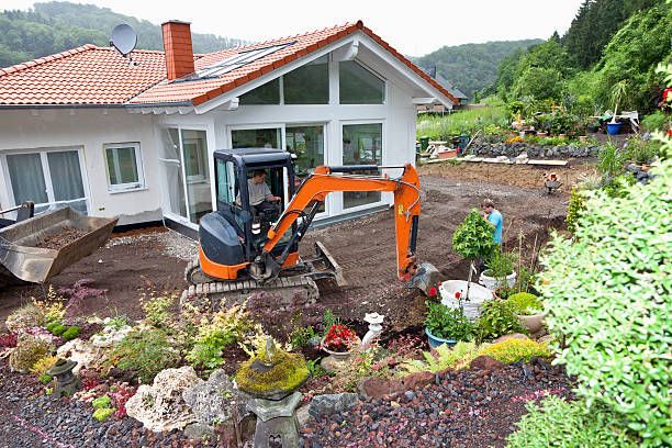 Workers with Heavy Equipment Transferring Drainage Pipe in House Building | Geelong, Vic | Don Barry’s Bobcat Hire