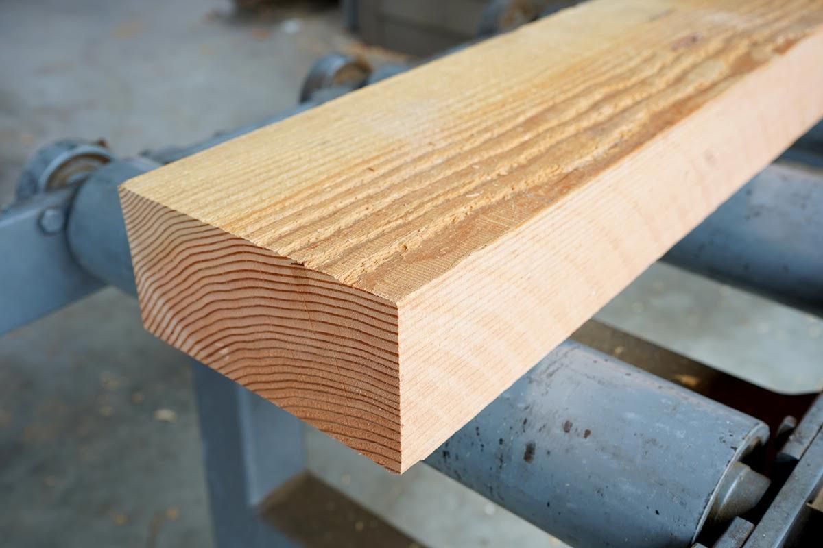 Wooden beam on a machine, showing the grain.