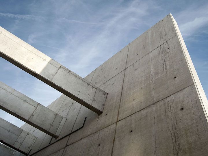 a concrete wall with a blue sky in the background