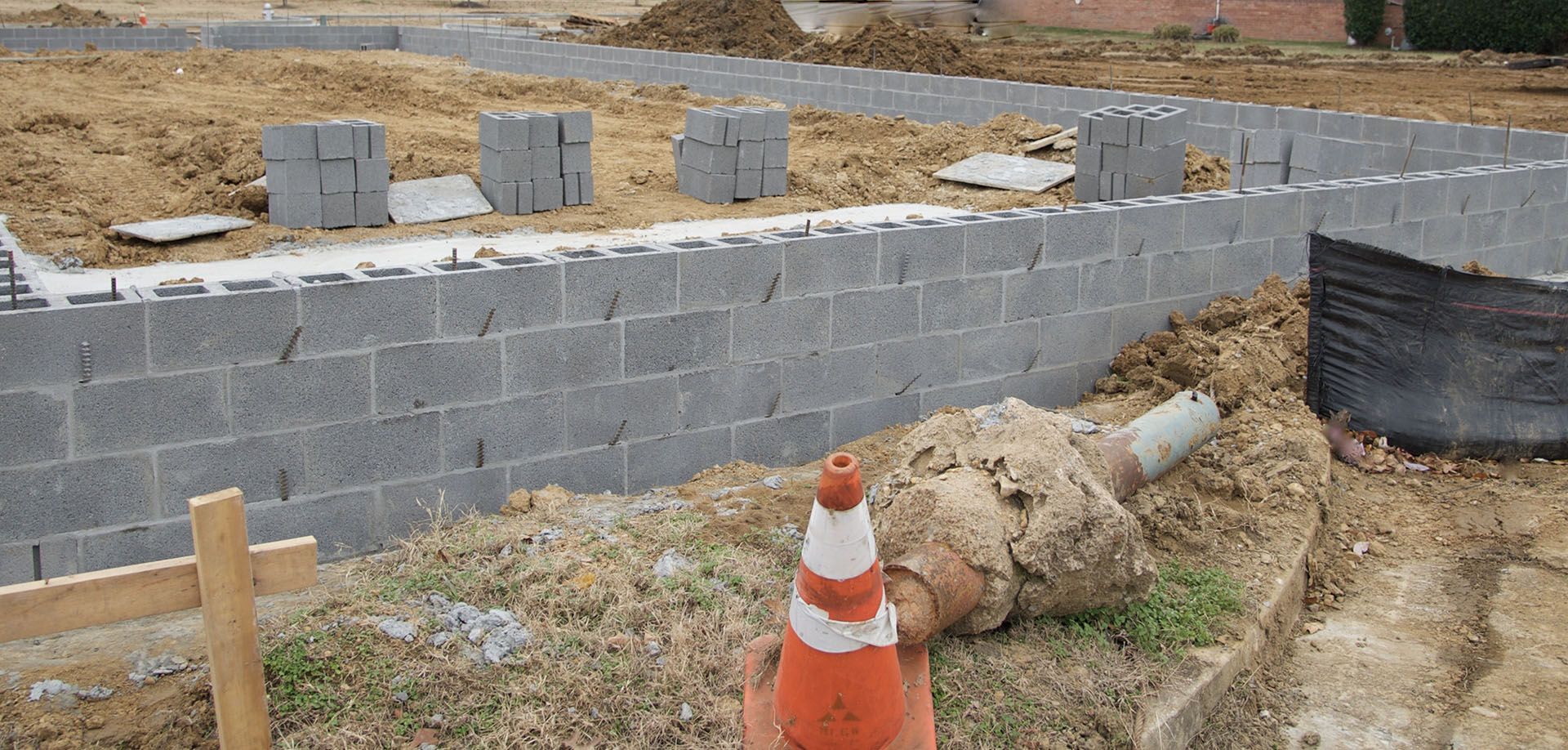 a construction site with a brick wall being built