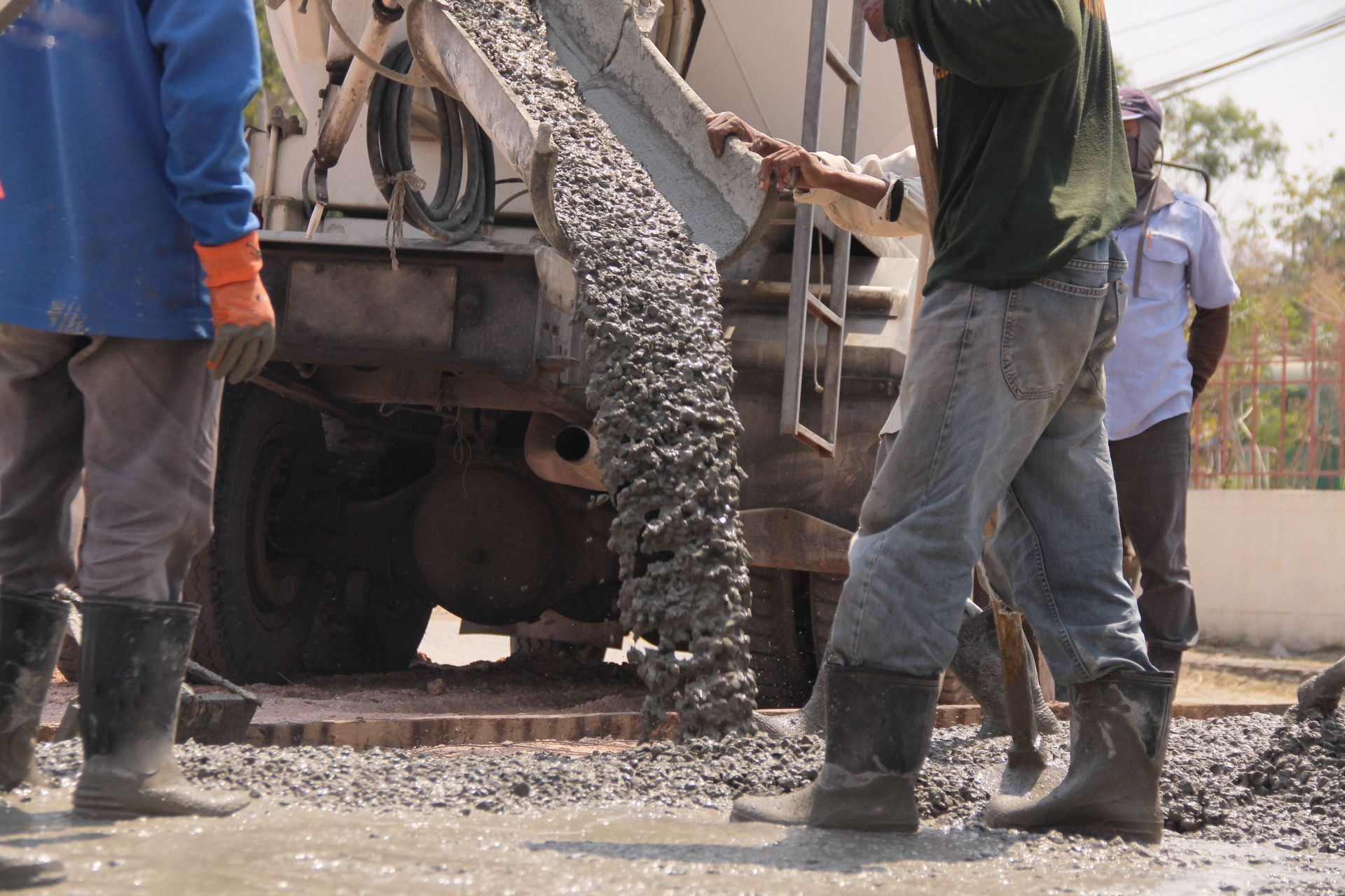 a concrete truck is pouring concrete into the ground