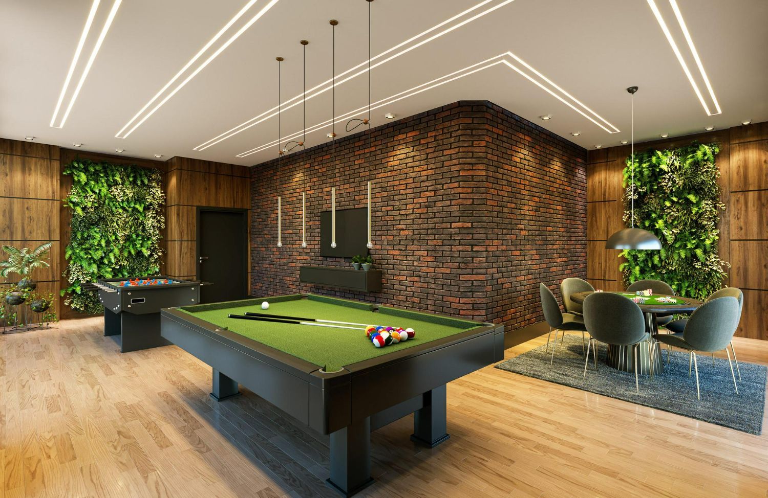 A game room with a pool table, foosball table, dining area, brick wall, and two vertical green walls.