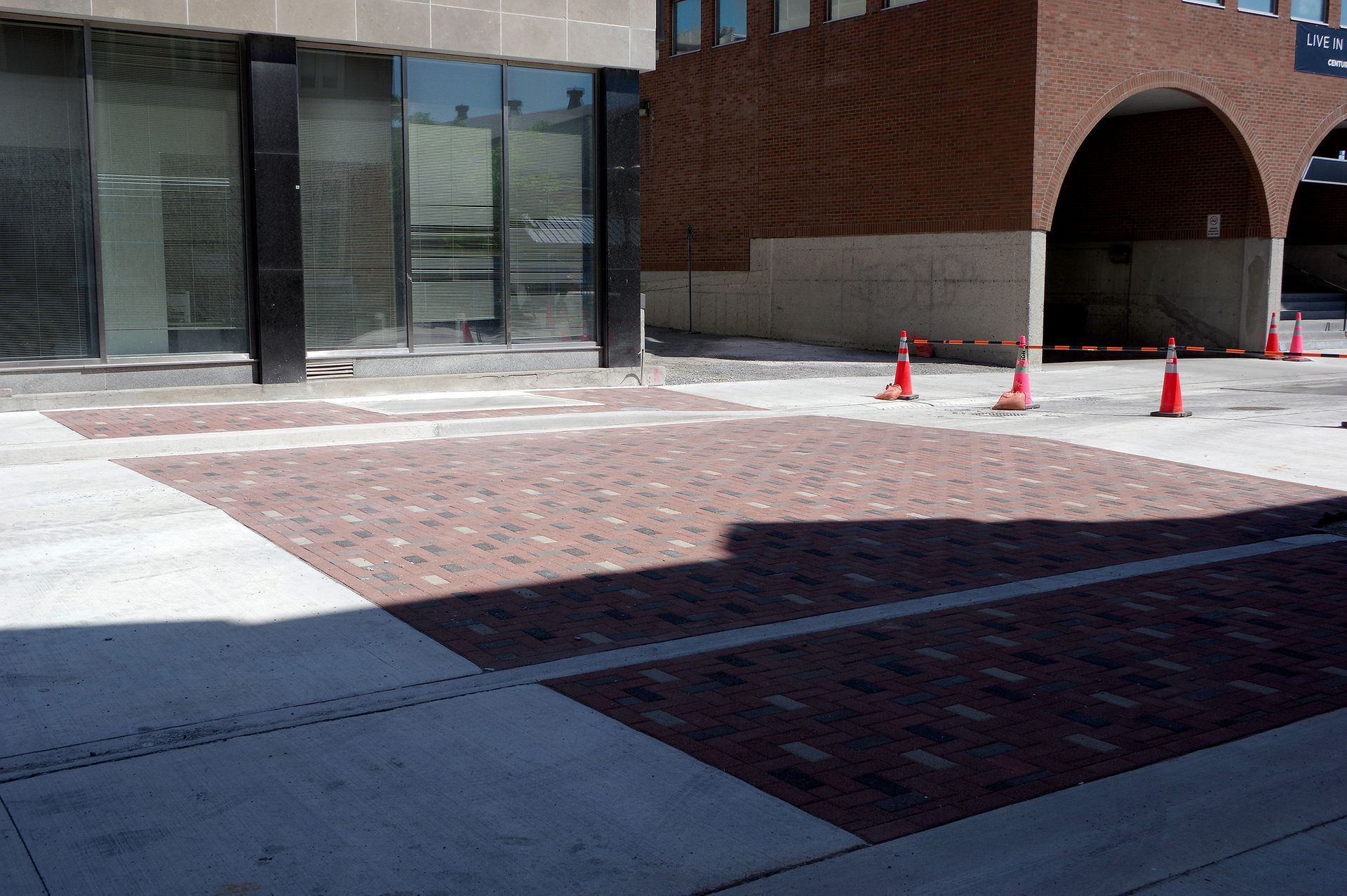A brick building with a brick walkway in front of it