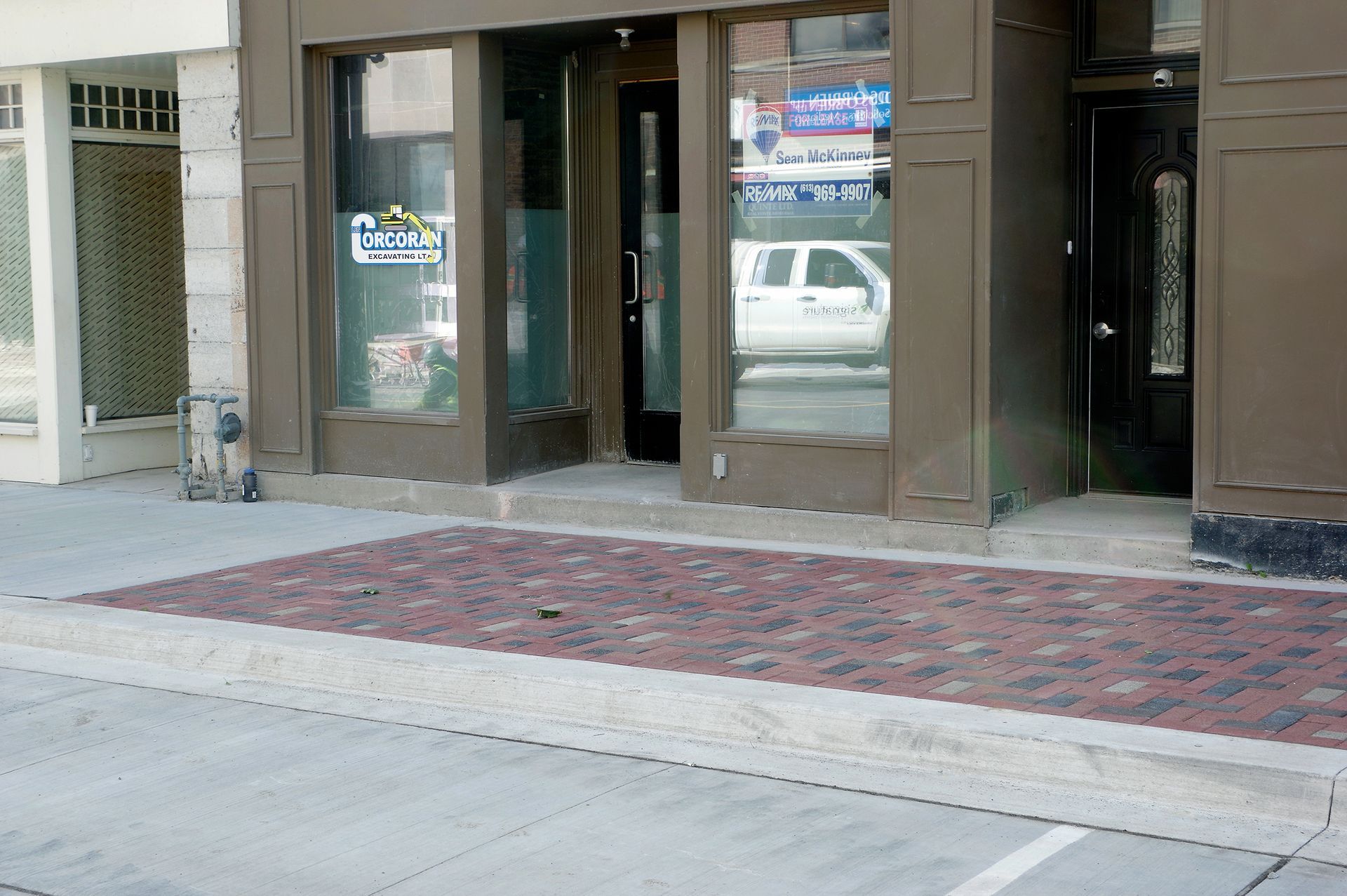 A store front with a sign that says ' book here ' on it