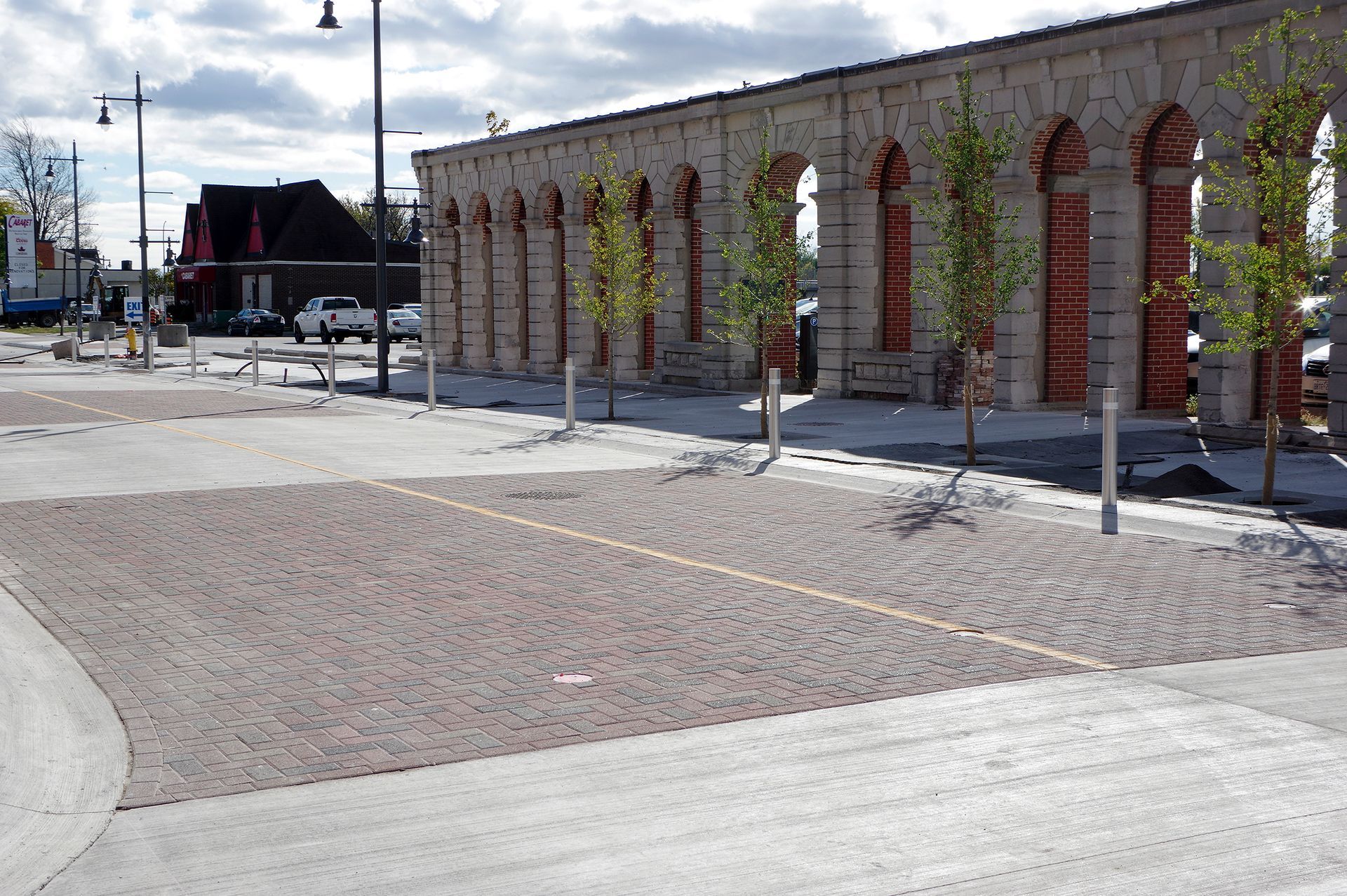 A building with arches and trees in front of it