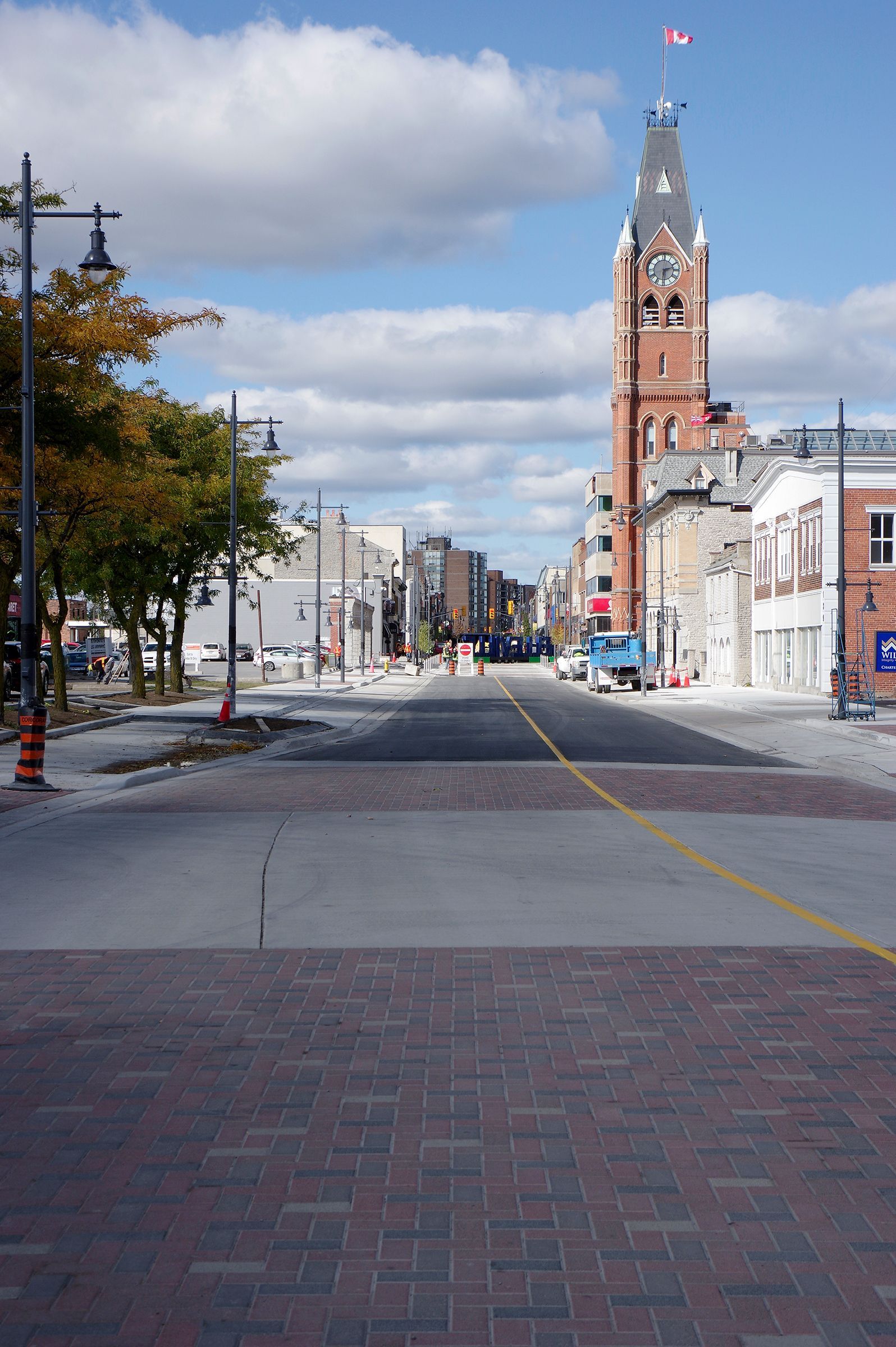 A city street with a clock tower in the background