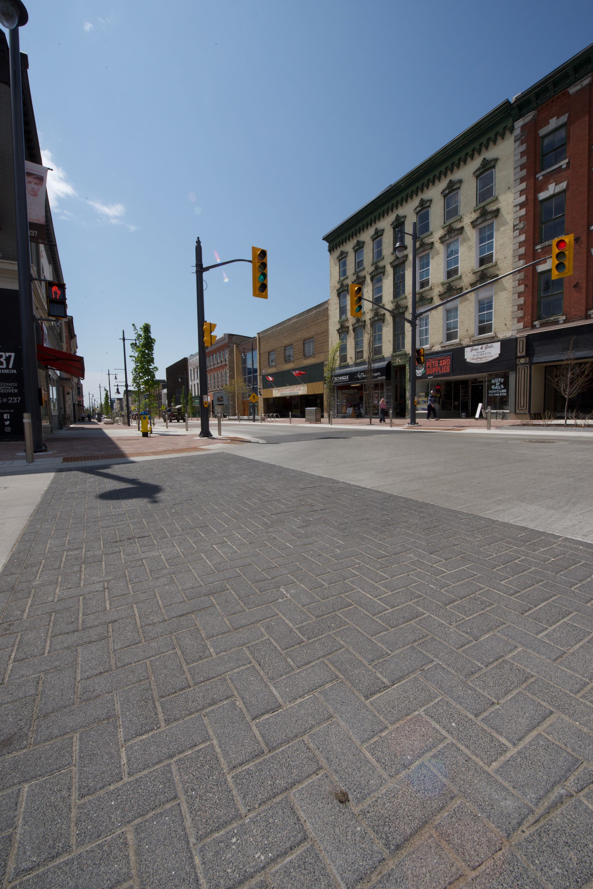 A city street with a fire hydrant in the middle of it
