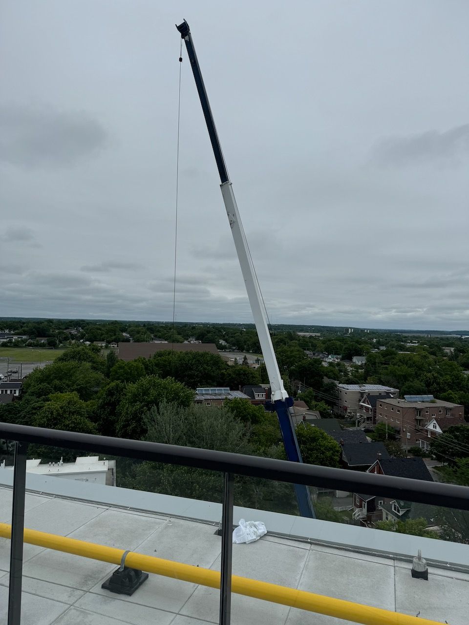 A large crane is sitting on top of a building
