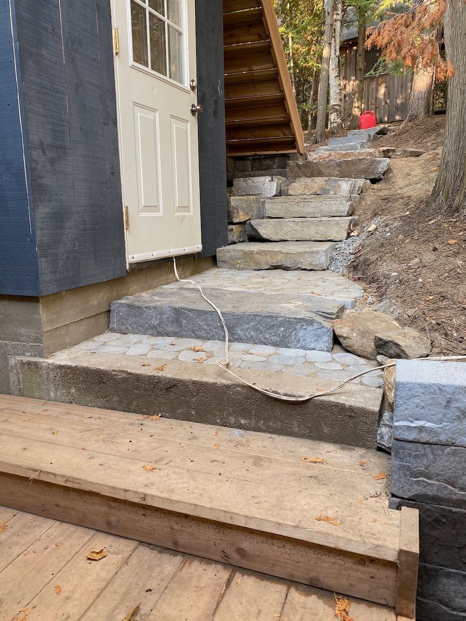 A set of stone stairs leading up to a house.