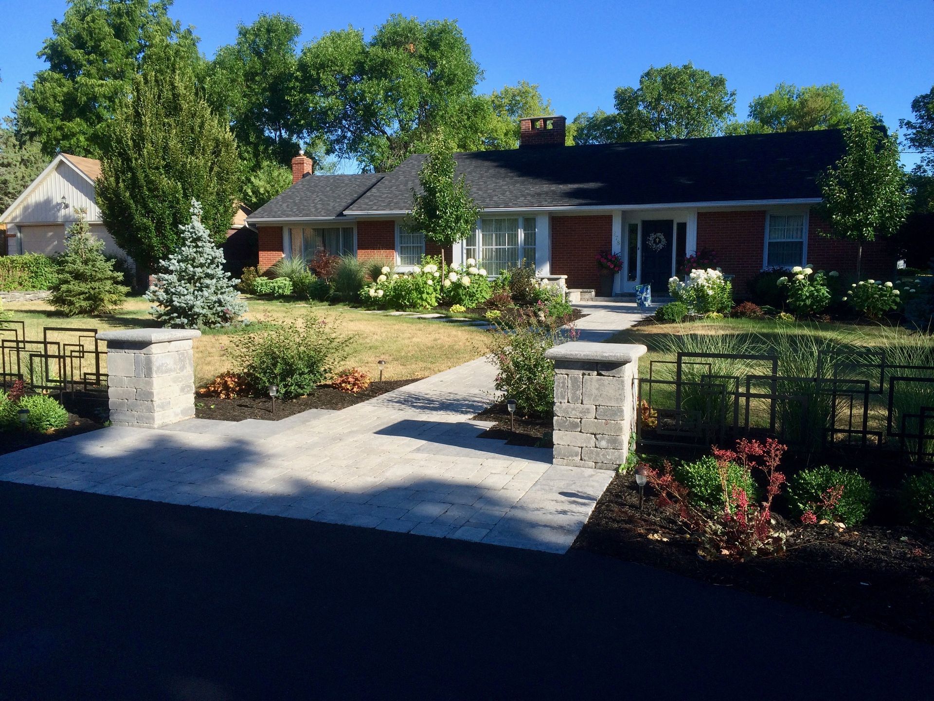 A brick house with a walkway leading to it