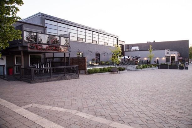 A large building with a brick walkway in front of it