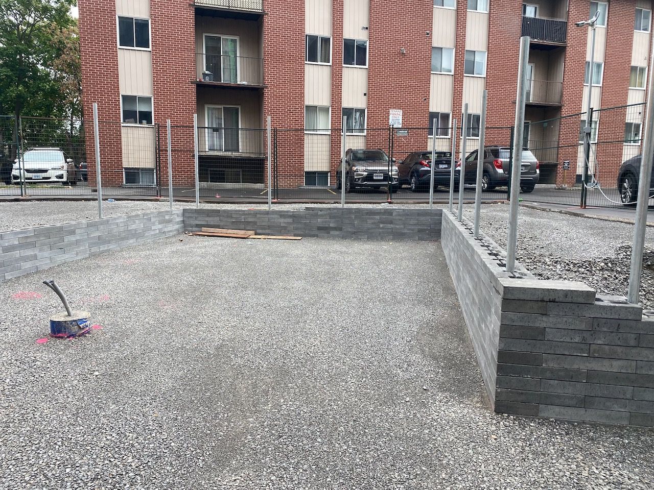 A brick building with cars parked in front of it