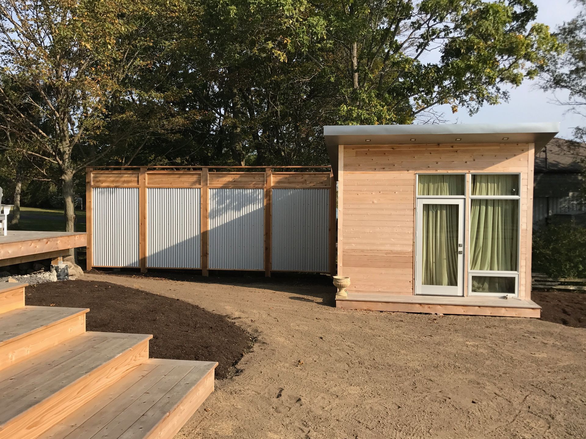 A small wooden house with stairs leading up to it