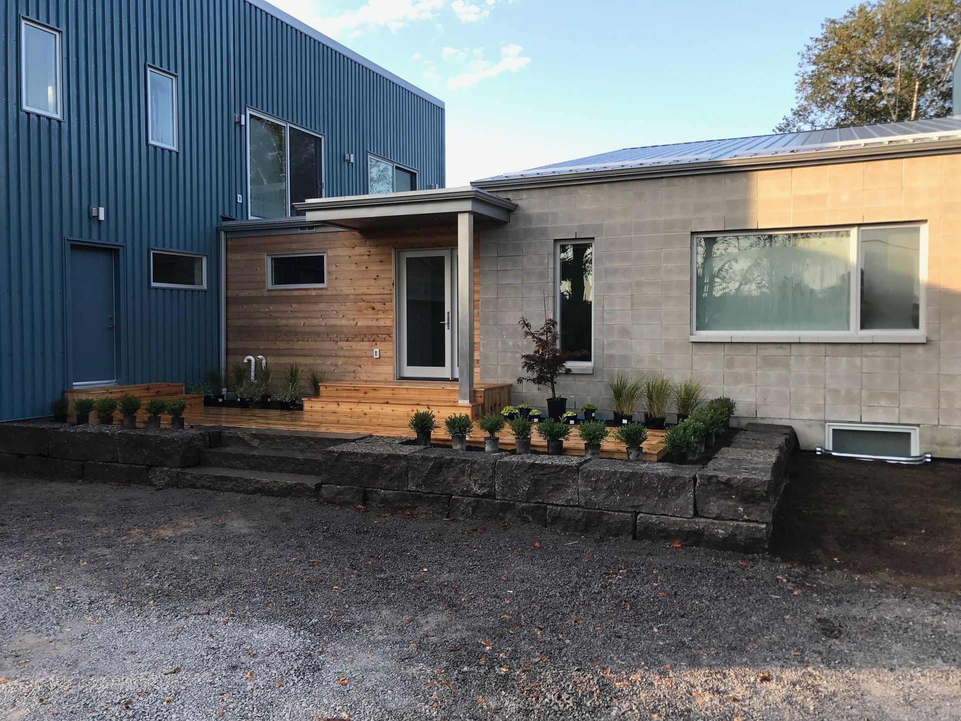 A house with a blue building in the background